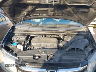2014 Honda Odyssey Touring with VIN 5FNRL5H90EB077054, listed as a IAAI auction lot 41904456 with 197,869 mi miles and . Bid and sale history available at carsss.com. Image 10.