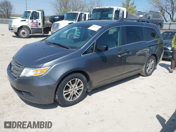 2012 Honda Odyssey EX-L with VIN 5FNRL5H69CB047425, listed as a IAAI auction lot 42064979 with 242,409 mi miles and . Bid and sale history available at carsss.com. Image 2.