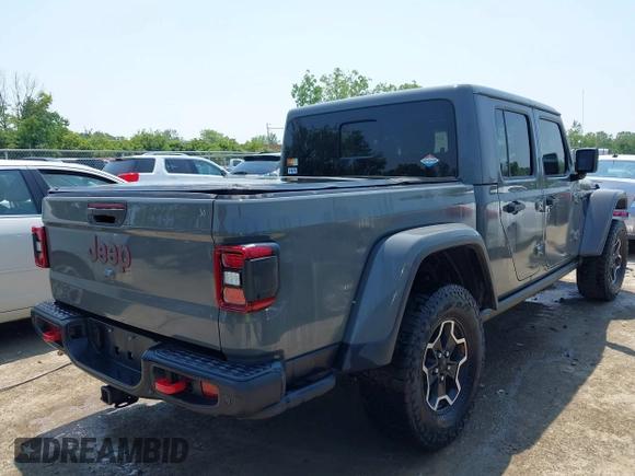 2021 Jeep Gladiator Rubicon with VIN 1C6JJTBG2ML515932, listed as a IAAI auction lot 42471704 with 57,775 mi miles and . Bid and sale history available at DreamBid. Image 4.