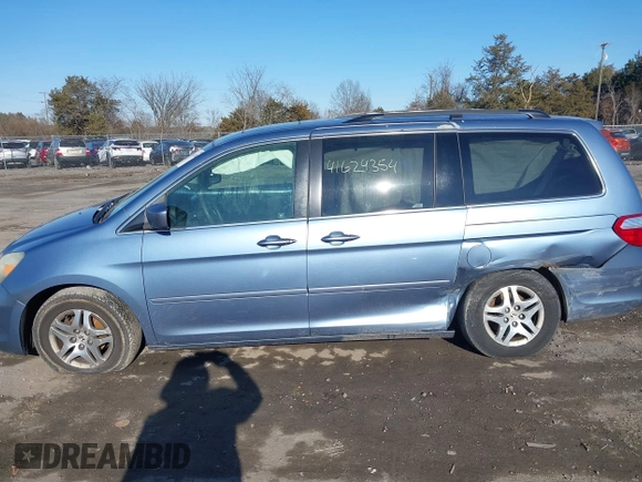 2005 Honda Odyssey EX-L with VIN 5FNRL38765B076591, listed as a IAAI auction lot 41624354 with 172,698 mi miles and . Bid and sale history available at DreamBid. Image 13.
