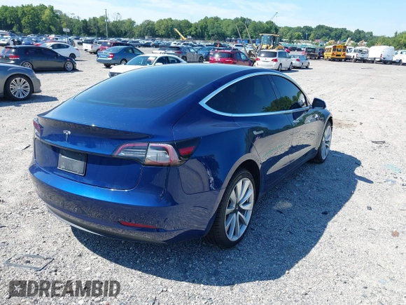2019 Tesla Model 3 Mid Range with VIN 5YJ3E1EA6KF402308, listed as a IAAI auction lot 40077902 with 89,794 mi miles and . Bid and sale history available at carsss.com. Image 4.