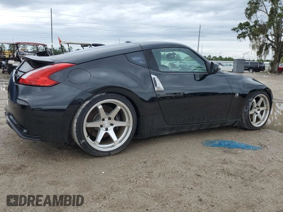 2009 Nissan 370Z Touring with VIN JN1AZ44E29M406023, listed as a Copart auction lot 73721324 with 108,072 mi miles and Salvage Title. Bid and sale history available at carsss.com. Image 3.