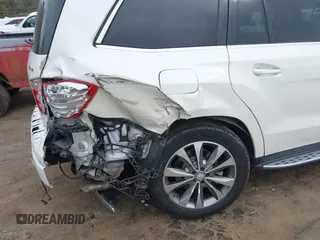 2016 Mercedes-Benz GL with VIN 4JGDF6EE7GA673861, listed as a IAAI auction lot 41803302 with 74,670 mi miles. Bid and sale history available at carsss.com. Image 6.