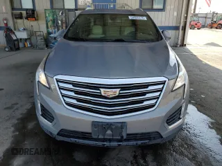 2019 Cadillac XT5 Luxury FWD z VIN 1GYKNCRS4KZ221304, wystawiony jako Copart lot #54995415 z przebiegiem 128 940 mil mil oraz Szkoda całkowita • Salvage title. Historia ofert i sprzedaży dostępna na DreamBid. Obrazek 5.