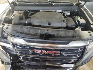 2021 GMC Canyon 4WD AT4 z VIN 1GTG6FEN1M1203936, wystawiony jako Copart lot #56041315 z przebiegiem 54 939 mil mil oraz Szkoda całkowita • Salvage title. Historia ofert i sprzedaży dostępna na DreamBid. Obrazek 11.