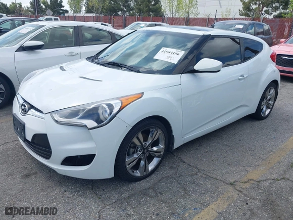 2015 Hyundai Veloster with VIN KMHTC6AD5FU231224, listed as a IAAI auction lot 41944186 with 103,124 mi miles. Bid and sale history available at carsss.com. Image 2.
