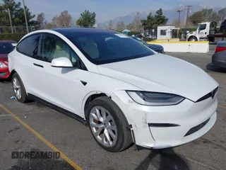 2022 Tesla Model X with VIN 7SAXCBE58NF336321, listed as a IAAI auction lot 41458205 with 21,916 mi miles. Bid and sale history available at carsss.com. Image 1.