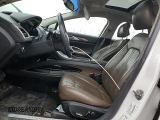 2014 Lincoln MKZ z VIN 3LN6L2G93ER811683, wystawiony jako Copart lot #52004485 z przebiegiem 188 134 mil mil oraz Szkoda całkowita • Salvage title. Historia ofert i sprzedaży dostępna na DreamBid. Obrazek 7.