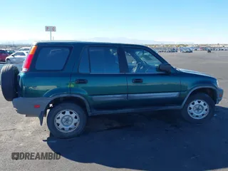 1999 Honda CR-V LX with VIN JHLRD1847XC031475, listed as a IAAI auction lot 41606369 with 254,445 mi miles. Bid and sale history available at carsss.com. Image 12.