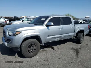 2018 Toyota Tacoma SR5 z VIN 3TMAZ5CN8JM077857, wystawiony jako Copart lot #52570945 z przebiegiem 50 182 mil mil oraz Szkoda całkowita • Salvage title. Historia ofert i sprzedaży dostępna na DreamBid. Obrazek 1.