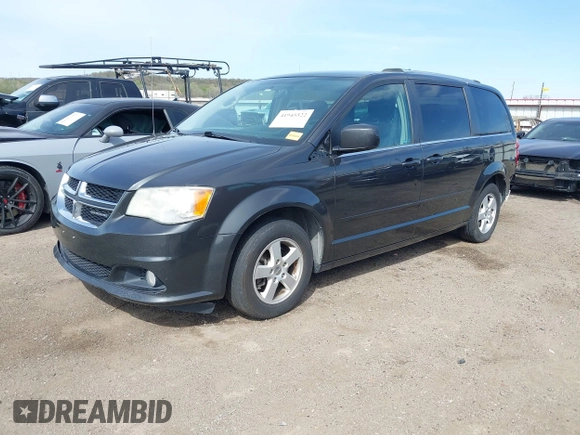 2011 Dodge Grand Caravan Crew with VIN 2D4RN5DG3BR660235, listed as a IAAI auction lot 41945522 with 148,924 mi miles and . Bid and sale history available at DreamBid. Image 2.