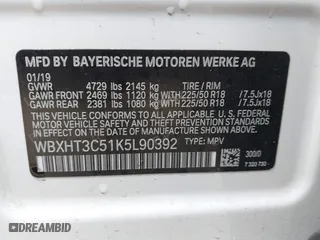 2019 BMW X1 xDrive28i with VIN WBXHT3C51K5L90392, listed as a IAAI auction lot 41571403 with 96,732 mi miles. Bid and sale history available at carsss.com. Image 9.