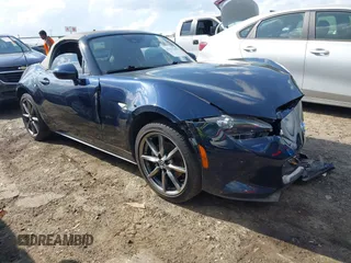 2021 Mazda MX-5 Miata Grand Touring with VIN JM1NDAD79M0457032, listed as a IAAI auction lot 41931348 with 47,874 mi miles and . Bid and sale history available at DreamBid. Image 1.