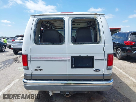 1999 Ford Econoline Cargo Recreational with VIN 1FDRE14L2XHA41059, listed as a IAAI auction lot 42067879 with 149,185 mi miles. Bid and sale history available at carsss.com. Image 16.