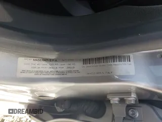 2014 Maserati Ghibli z VIN ZAM57XSA8E1087661, wystawiony jako Copart lot #54215595 z przebiegiem 108 280 mil mil oraz Szkoda całkowita • Salvage title. Historia ofert i sprzedaży dostępna na DreamBid. Obrazek 12.