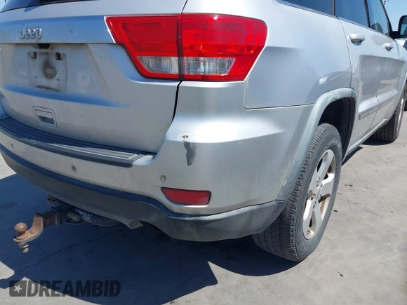 2012 Jeep Grand Cherokee Laredo with VIN 1C4RJEAG5CC112230, listed as a IAAI auction lot 41997483 with 302,923 mi miles. Bid and sale history available at carsss.com. Image 17.