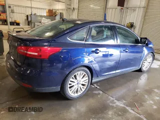 2016 Ford Focus Titanium z VIN 1FADP3J27GL310367, wystawiony jako Copart lot #55048005 z przebiegiem 86 676 mil mil oraz Szkoda całkowita • Salvage title. Historia ofert i sprzedaży dostępna na DreamBid. Obrazek 3.