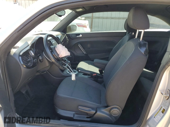 2016 Volkswagen Beetle with VIN 3VWF07AT9GM619860, listed as a Copart auction lot 56357605 with 67,212 mi miles and Salvage Title. Bid and sale history available at DreamBid. Image 7.