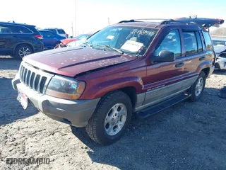 1999 Jeep Grand Cherokee Laredo with VIN 1J4GW58S5XC781472, listed as a IAAI auction lot 41738515 with 216,000 mi miles. Bid and sale history available at carsss.com. Image 17.