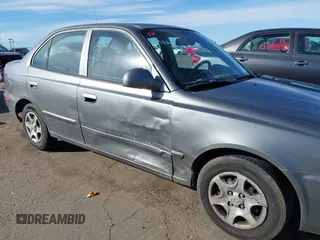 2004 Hyundai Accent GL with VIN KMHCG45C04U531177, listed as a IAAI auction lot 41526033 with 126,102 mi miles. Bid and sale history available at carsss.com. Image 6.
