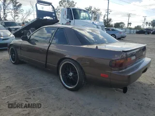 1991 Nissan 240SX z VIN JN1MS34PXMW001053, wystawiony jako Copart lot #79007744 z przebiegiem 172 425 mil mil oraz Nie do naprawy. Historia ofert i sprzedaży dostępna na DreamBid. Obrazek 2.