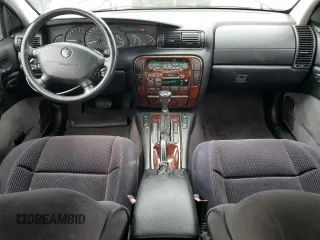 1997 Cadillac Catera z VIN W06VR52RXVR092016, wystawiony jako Copart lot #54067575 z przebiegiem 63 978 mil mil oraz Tytuł czysty. Historia ofert i sprzedaży dostępna na DreamBid. Obrazek 8.