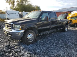 2003 Ford F-450 XL with VIN 1FDXW46P13EC18704, listed as a Copart auction lot 73657814 with 153,552 mi miles and Salvage Title. Bid and sale history available at carsss.com. Image 1.