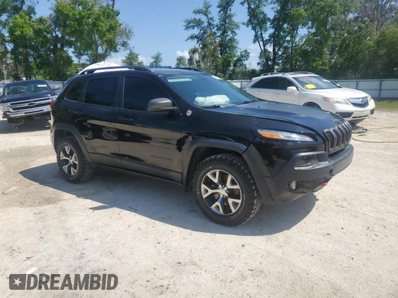 2017 Jeep Cherokee Trailhawk L Plus with VIN 1C4PJMBBXHW517252, listed as a Copart auction lot 51414315 with 185,274 mi miles and Salvage Title. Bid and sale history available at carsss.com. Image 4.