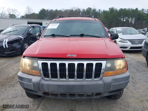 1999 Jeep Grand Cherokee Laredo with VIN 1J4GW58S0XC519908, listed as a IAAI auction lot 41789905 with 221,064 mi miles. Bid and sale history available at carsss.com. Image 13.