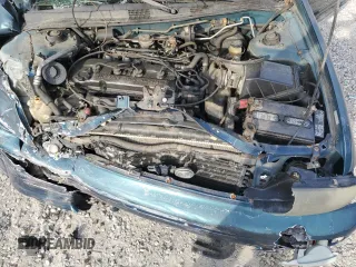 1997 Nissan Altima XE z VIN 1N4BU31D2VC138876, wystawiony jako Copart lot #53892515 z przebiegiem 155 286 mil mil oraz Szkoda całkowita • Salvage title. Historia ofert i sprzedaży dostępna na DreamBid. Obrazek 11.