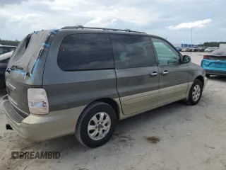 2004 Kia Sedona LX with VIN KNDUP131346575851, listed as a Copart auction lot 73614194 with 153,928 mi miles and Salvage Title. Bid and sale history available at carsss.com. Image 3.
