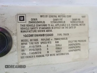 1998 Chevrolet Astro Cargo Van with VIN 1GCDM19W4WB133439, listed as a IAAI auction lot 41456062 with 310,476 mi miles. Bid and sale history available at carsss.com. Image 9.