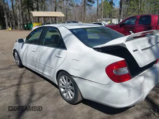 2003 Toyota Camry LE z VIN JTDBF30K930147772, wystawiony jako IAAI lot #41768713 z przebiegiem 231 537 mil mil oraz . Historia ofert i sprzedaży dostępna na DreamBid. Obrazek 3.