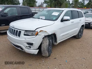 2014 Jeep Grand Cherokee Overland with VIN 1C4RJECG4EC543092, listed as a IAAI auction lot 40981315 with 149,096 mi miles. Bid and sale history available at carsss.com. Image 2.
