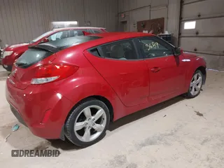 2013 Hyundai Veloster w/Gray Int with VIN KMHTC6AD2DU136990, listed as a IAAI auction lot 41363689 with 74,594 mi miles. Bid and sale history available at carsss.com. Image 4.