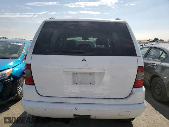 2000 Mercedes-Benz M-Class with VIN 4JGAB54E5YA165660, listed as a Copart auction lot 65872364 with 115,668 mi miles and Salvage Title. Bid and sale history available at carsss.com. Image 6.