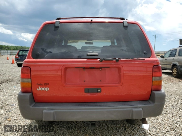 1997 Jeep Grand Cherokee Laredo with VIN 1J4GZ58S3VC739922, listed as a Copart auction lot 55667885 with 209,075 mi miles and Salvage title. Bid and sale history available at DreamBid. Image 6.