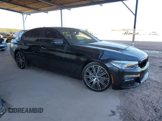 2018 BMW 5 Series 540i xDrive with VIN WBAJE7C5XJWD52054, listed as a Copart auction lot 47306535 with 49,185 mi miles and Salvage title. Bid and sale history available at DreamBid. Image 4.
