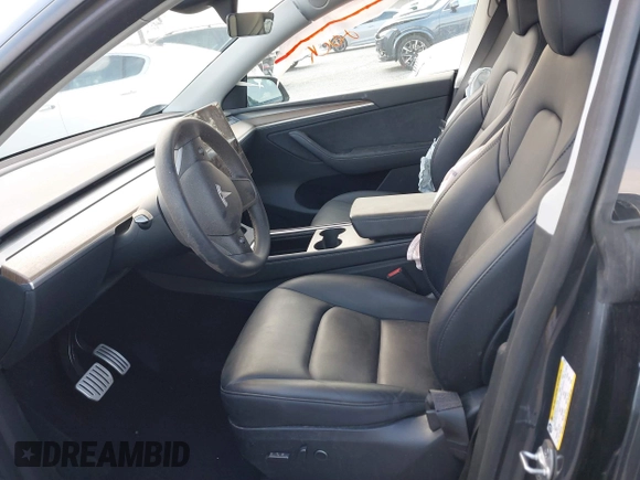 2023 Tesla Model Y Performance with VIN 7SAYGDEF6PF837174, listed as a IAAI auction lot 41436629 with 22,799 mi miles and . Bid and sale history available at DreamBid. Image 5.