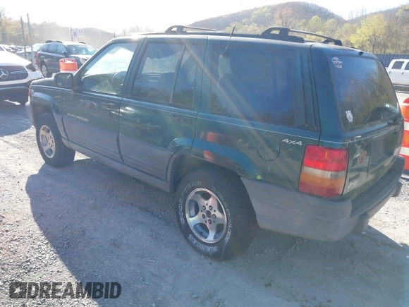 1996 Jeep Grand Cherokee with VIN 1J4EZ58Y7TC128428, listed as a IAAI auction lot 42050443 with 241,591 mi miles and . Bid and sale history available at DreamBid. Image 3.