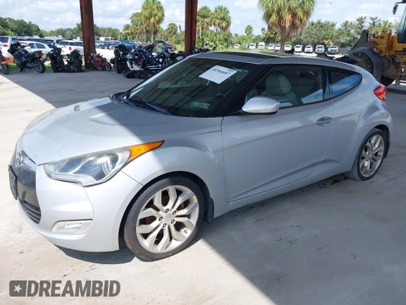 2012 Hyundai Veloster w/Gray Int z VIN KMHTC6ADXCU056898, wystawiony jako IAAI lot #40366687 z przebiegiem 137 161 mil mil oraz . Historia ofert i sprzedaży dostępna na DreamBid. Obrazek 2.