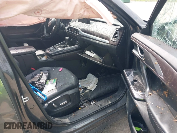 2016 Mazda CX-9 Grand Touring with VIN JM3TCBDY3G0117802, listed as a IAAI auction lot 42150821 with 157,760 mi miles and . Bid and sale history available at DreamBid. Image 5.