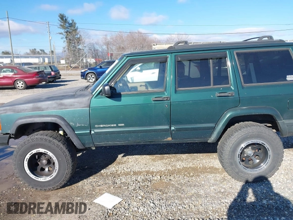 2001 Jeep Cherokee Sport with VIN 1J4FF58S41L619254, listed as a IAAI auction lot 41596384 with 180,826 mi miles and . Bid and sale history available at DreamBid. Image 14.