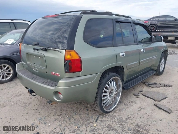 2004 GMC Envoy SLE with VIN 1GKDS13S442240682, listed as a IAAI auction lot 41764185 with 139,348 mi miles. Bid and sale history available at carsss.com. Image 4.