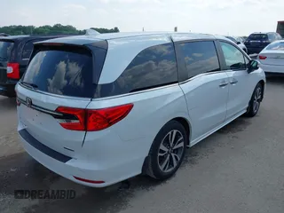 2023 Honda Odyssey Touring with VIN 5FNRL6H8XPB038875, listed as a IAAI auction lot 42441076 with 13,947 mi miles and . Bid and sale history available at DreamBid. Image 4.