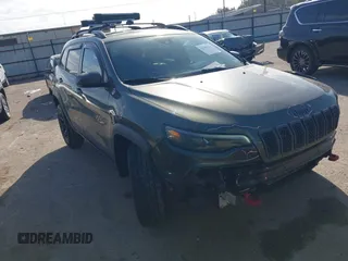 2021 Jeep Cherokee Trailhawk z VIN 1C4PJMBX9MD125087, wystawiony jako IAAI lot #41780564 z przebiegiem 75 212 mil mil oraz . Historia ofert i sprzedaży dostępna na DreamBid. Obrazek 1.