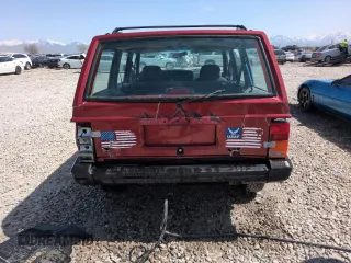 1996 Jeep Cherokee Sport with VIN 1J4FJ68S6TL171056, listed as a Copart auction lot 52099555 with 250,089 mi miles and Salvage Title. Bid and sale history available at carsss.com. Image 6.