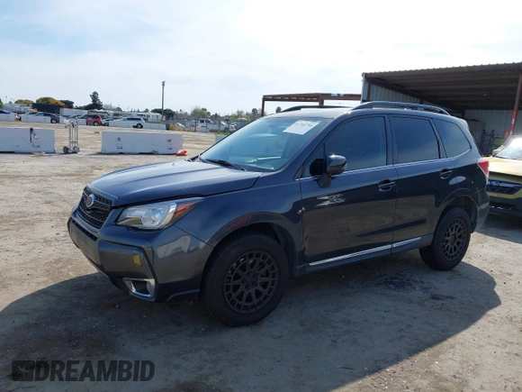 2018 Subaru Forester Touring with VIN JF2SJGWCXJH601162, listed as a IAAI auction lot 41760750 with 69,655 mi miles. Bid and sale history available at carsss.com. Image 2.