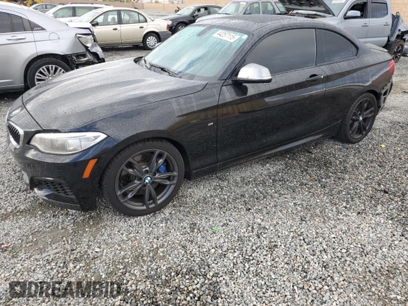 2014 BMW 2 Series M235i with VIN WBA1J7C55EVW84665, listed as a Copart auction lot 44257115 with 111,461 mi miles and Salvage title. Bid and sale history available at DreamBid. Image 1.
