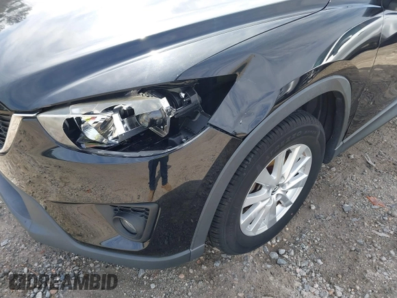 2014 Mazda CX-5 Touring with VIN JM3KE2CY9E0333951, listed as a IAAI auction lot 41825345 with 124,684 mi miles. Bid and sale history available at carsss.com. Image 6.